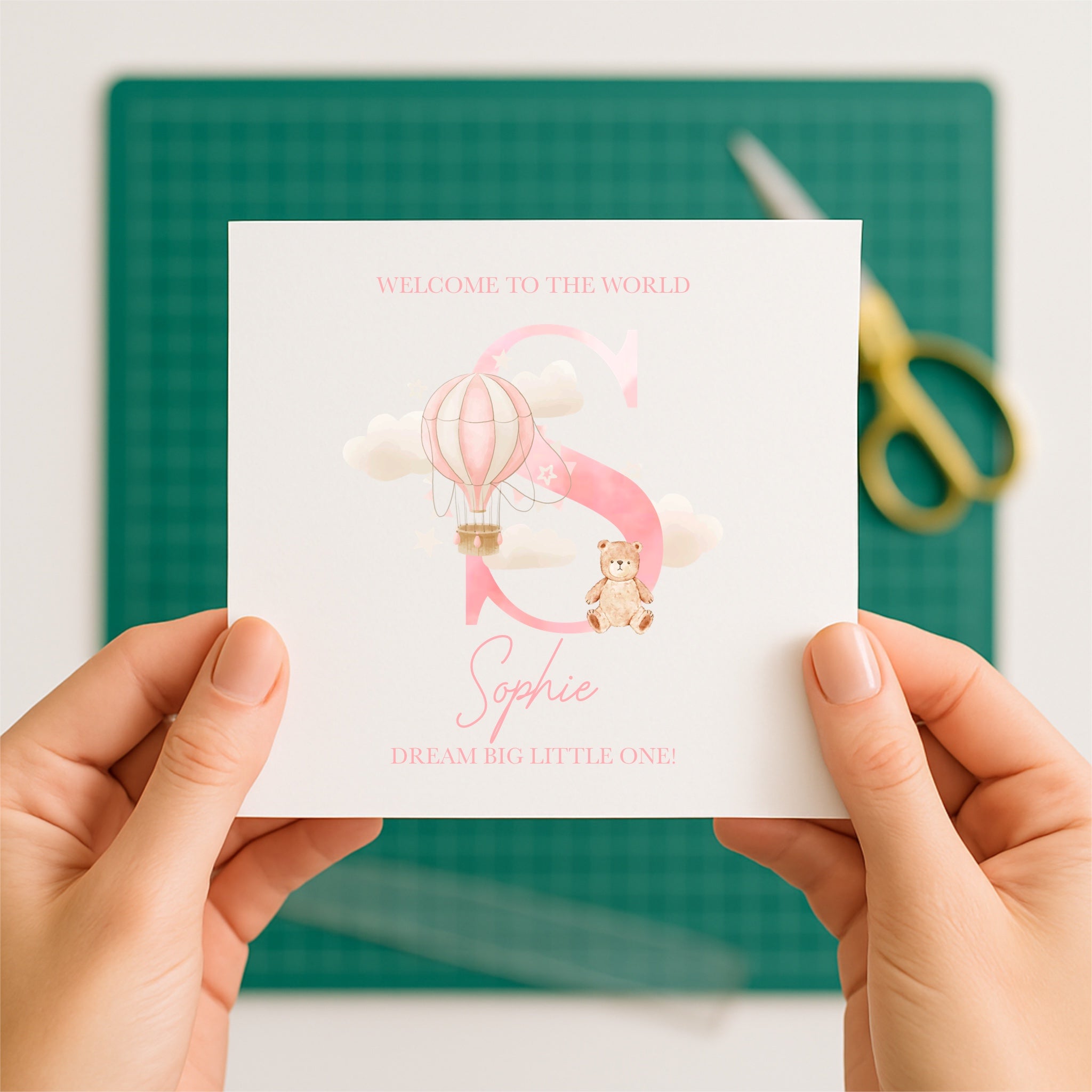 Personalised card being held